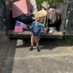 EZ Junk & Hauling trailer being loaded during a junk removal Keizer pickup