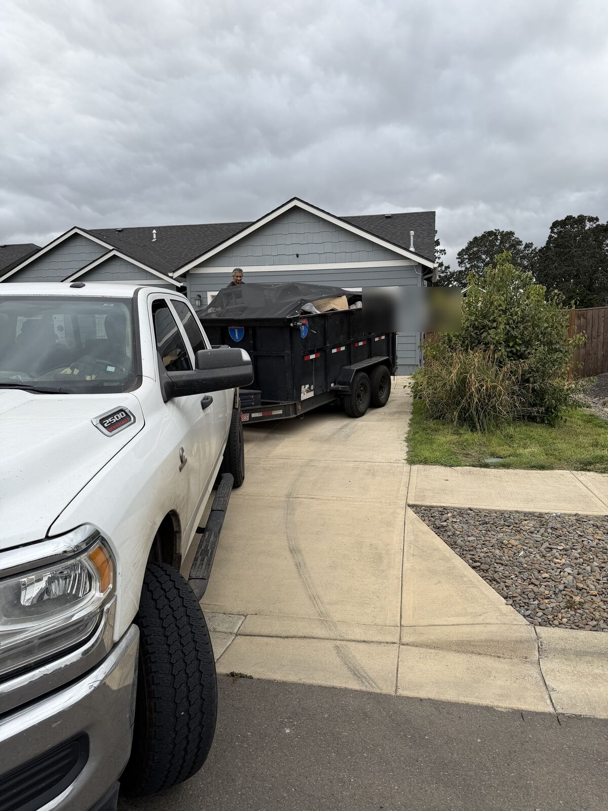 Junk removal in Lebanon, Oregon: EZ Junk and Hauling dump trailer loaded on a driveway pickup